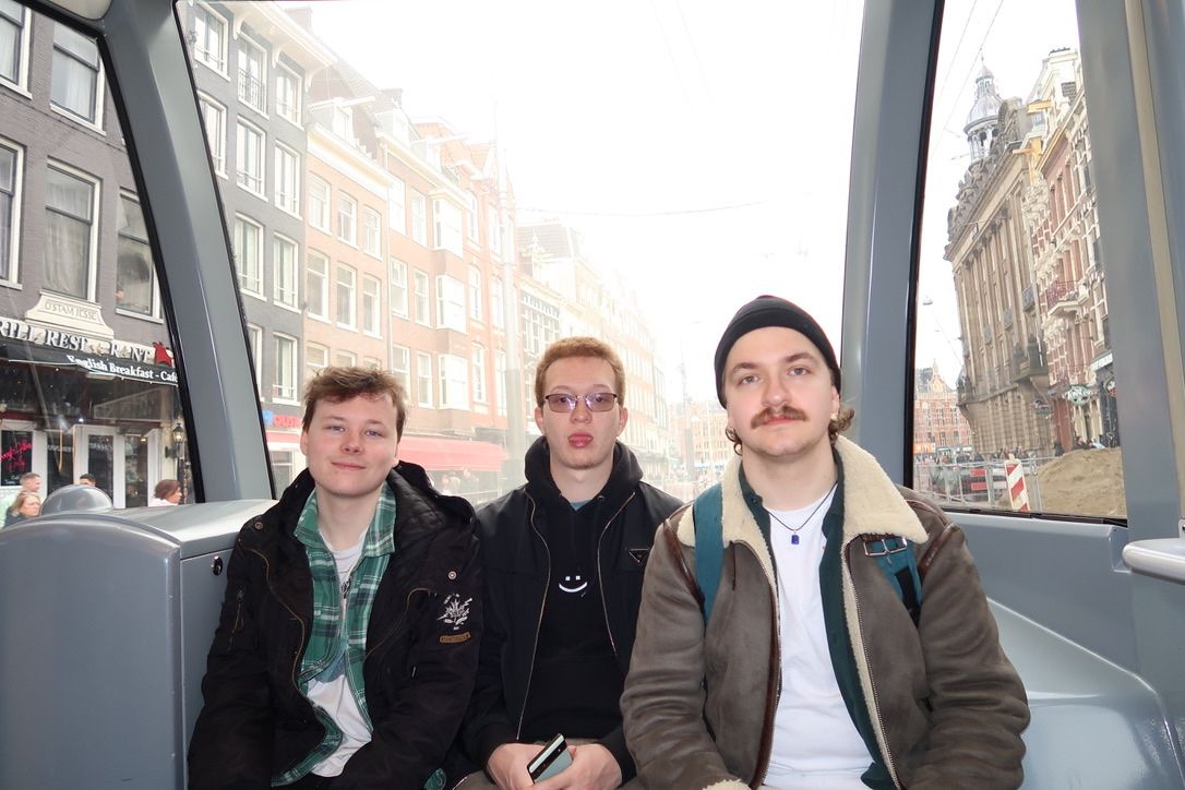 (From left to right) Dylan (Groomsman), Josh (Best Man), and Charlie (Groom) on a tram in Amsterdam.